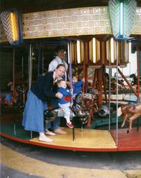 Nay Aug Amusement Park carousel riders.