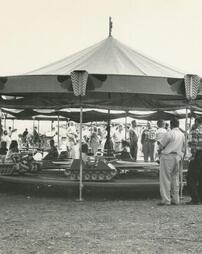 Nay Aug Amusement Park carousel with tanks.