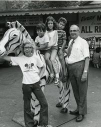 Nay Aug Amusement Park children on zebra.